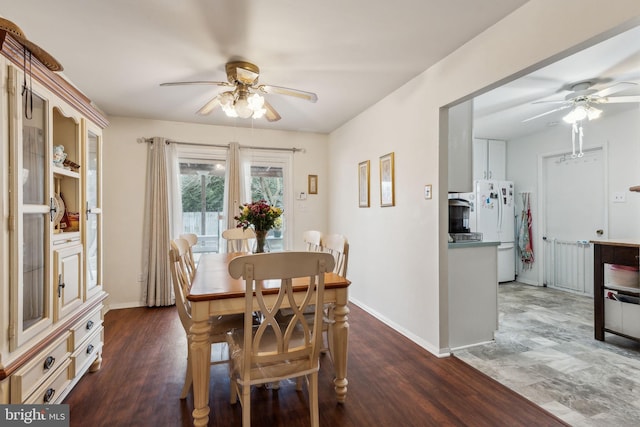 dining room featuring ceiling fan, baseboards, and wood finished floors