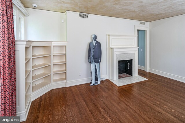 82 Library Pl, Princeton, NJ 08540 - unfurnished living room with wood finished floors, a fireplace with flush hearth, and baseboards