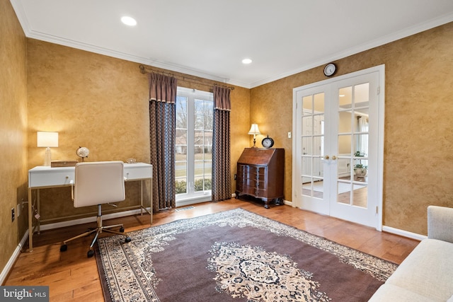 office with hardwood / wood-style flooring, baseboards, ornamental molding, and french doors