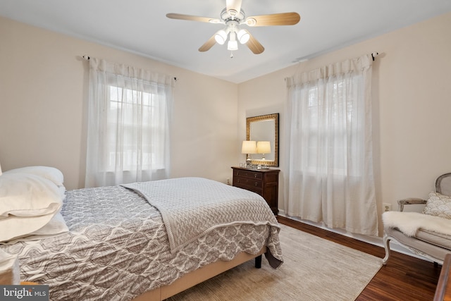 bedroom with ceiling fan and wood finished floors