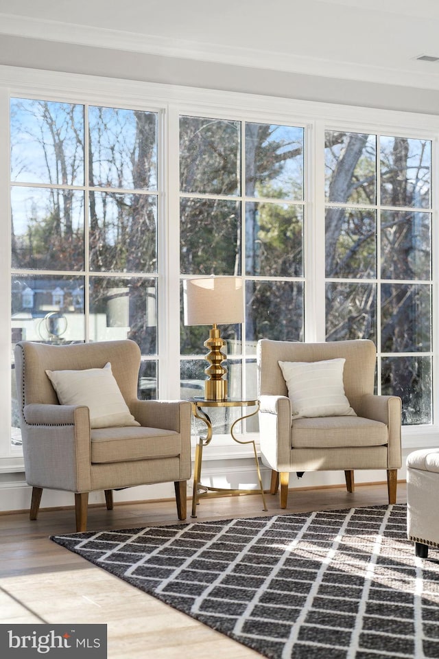 sunroom featuring plenty of natural light and visible vents