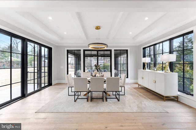 dining space featuring light wood-style floors, baseboards, beamed ceiling, and recessed lighting