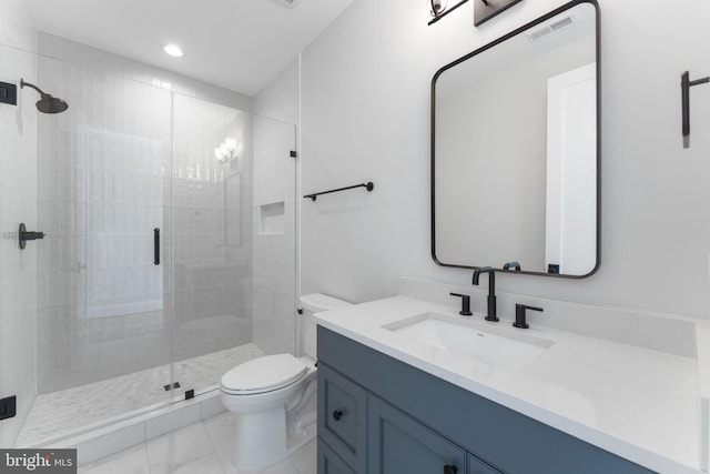 bathroom with a stall shower, visible vents, vanity, and toilet