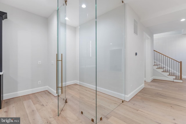 bathroom featuring recessed lighting, visible vents, baseboards, and wood finished floors