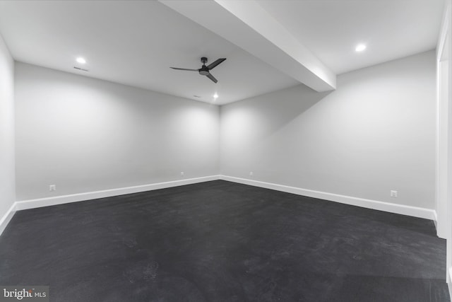 spare room featuring a ceiling fan, recessed lighting, finished concrete floors, and baseboards