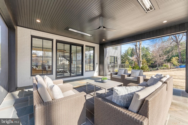 view of patio / terrace featuring ceiling fan and an outdoor living space