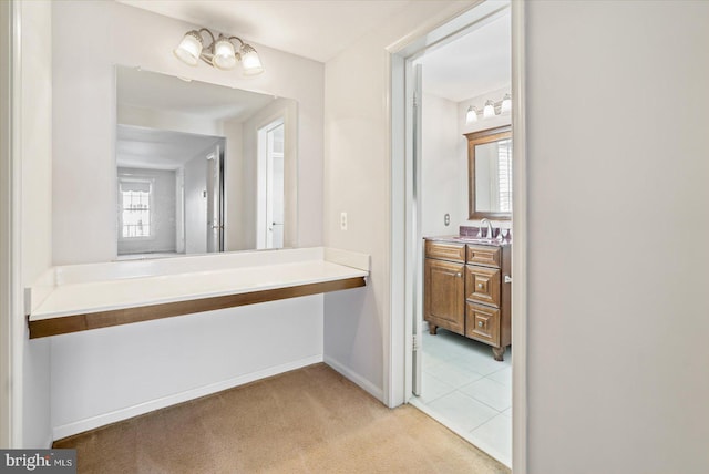 bathroom featuring baseboards and vanity