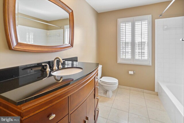 full bath featuring vanity, tile patterned floors, toilet, and tub / shower combination