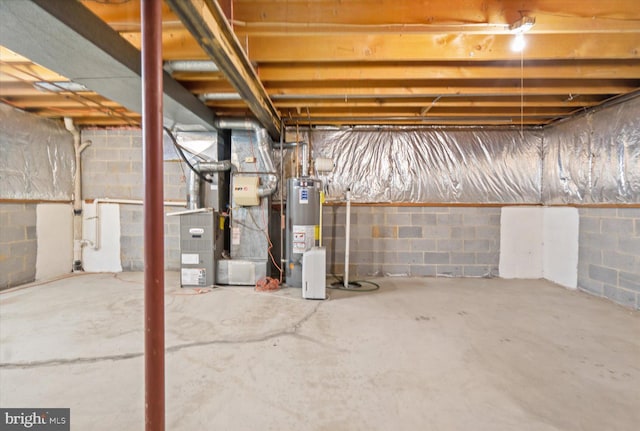 unfinished below grade area featuring gas water heater and heating unit