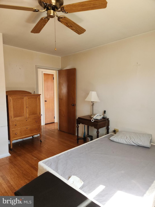 bedroom with ceiling fan and wood finished floors