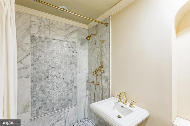 full bathroom with a tile shower and ornamental molding
