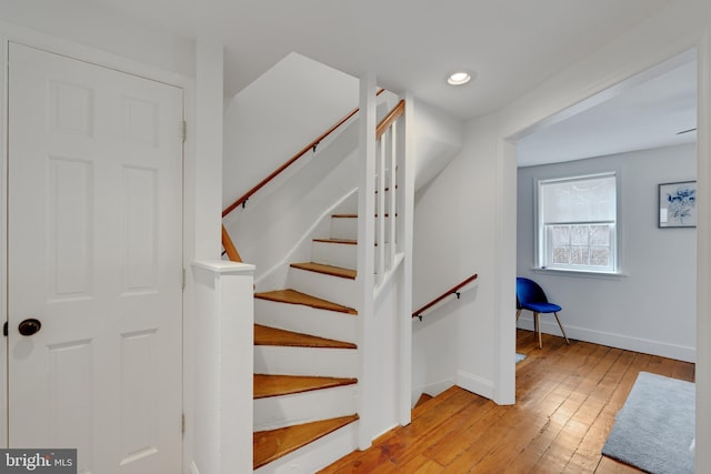 stairs featuring recessed lighting, baseboards, and wood-type flooring