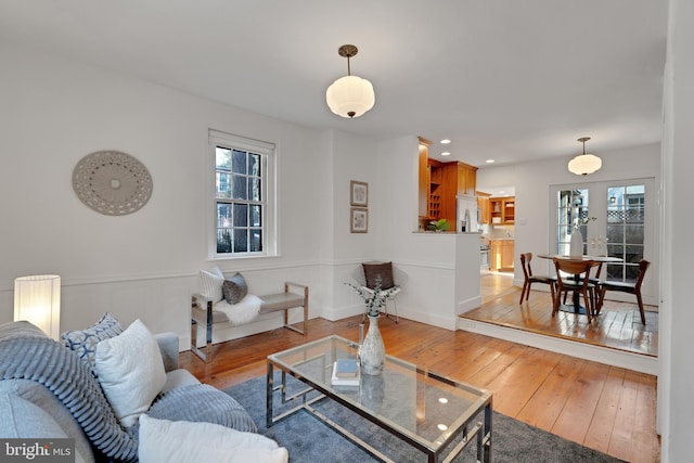 living room with recessed lighting and wood-type flooring