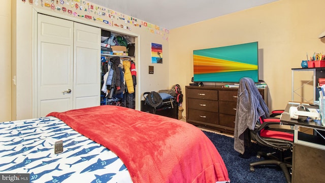 bedroom with a closet and carpet flooring