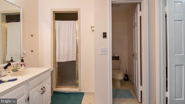 full bath with tile patterned floors, toilet, a stall shower, and vanity