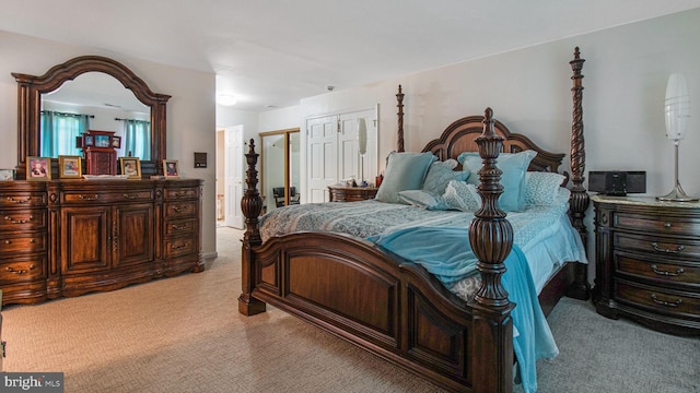 bedroom featuring light colored carpet