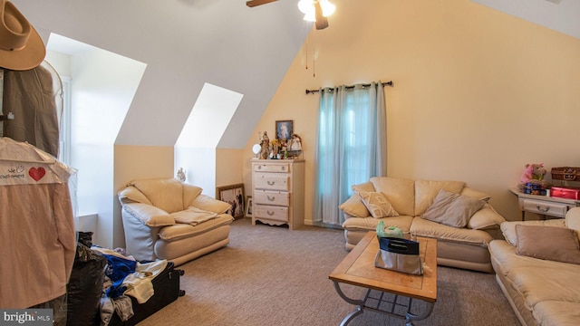 carpeted living area with vaulted ceiling and ceiling fan