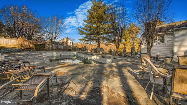 view of patio with a fenced in pool and a fenced backyard