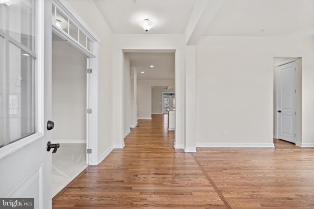 entrance foyer featuring light wood-type flooring and baseboards