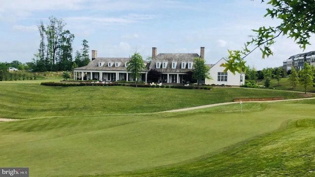 view of home's community featuring a lawn