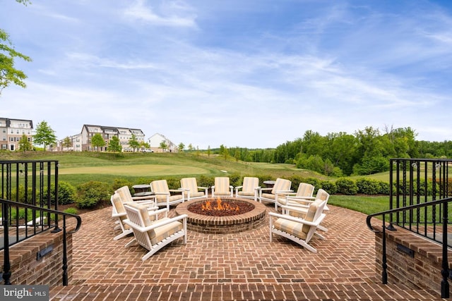 view of patio / terrace with a fire pit