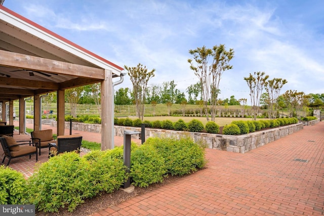 view of property's community featuring fence