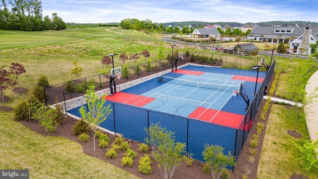 exterior space with community basketball court and fence