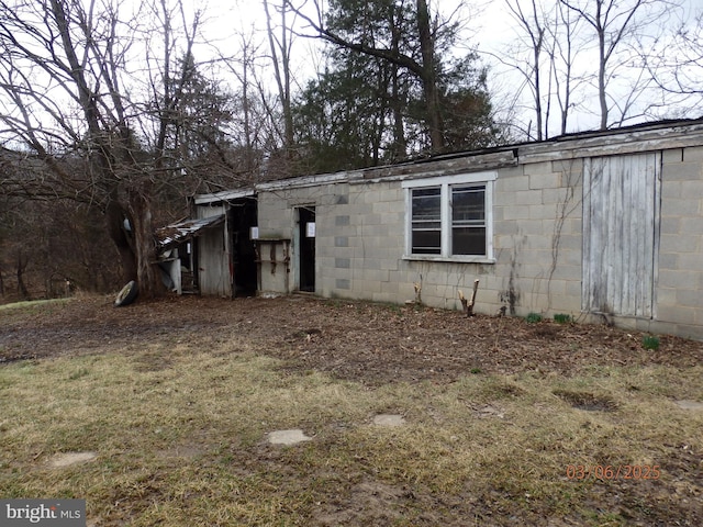 exterior space with concrete block siding