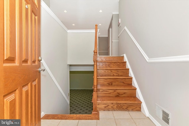 stairway with visible vents, recessed lighting, crown molding, tile patterned flooring, and baseboards