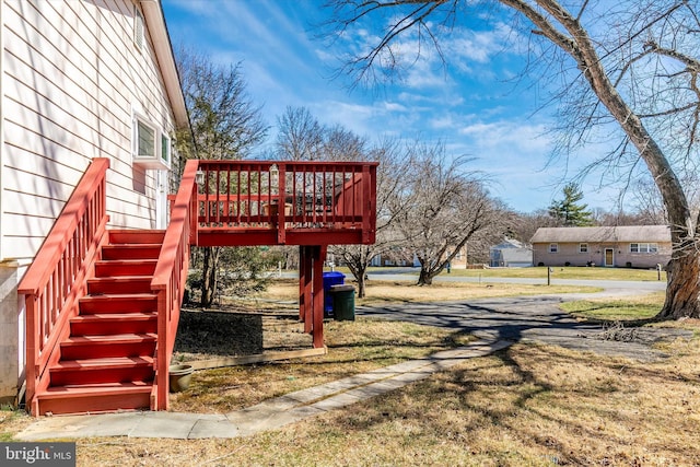 view of yard featuring stairway and a wooden deck