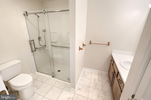 full bath with marble finish floor, toilet, a shower stall, vanity, and baseboards