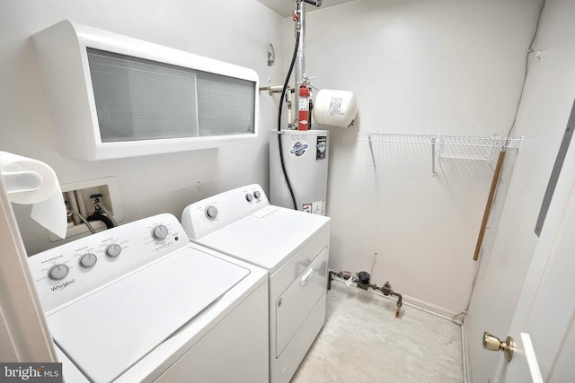 laundry area featuring washer and dryer, laundry area, and gas water heater