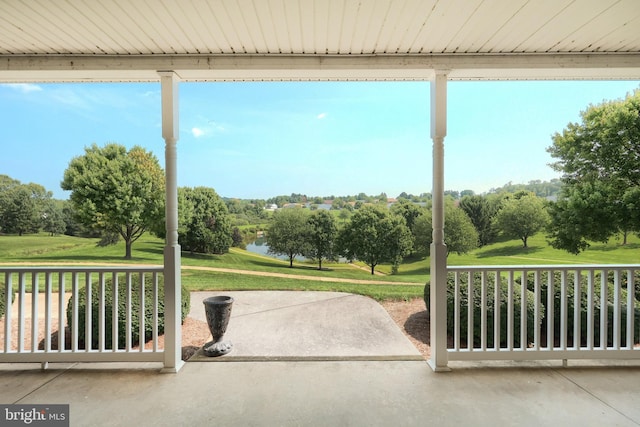 view of patio featuring a water view