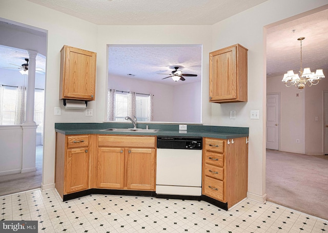 kitchen featuring dark countertops, a sink, a textured ceiling, and white dishwasher