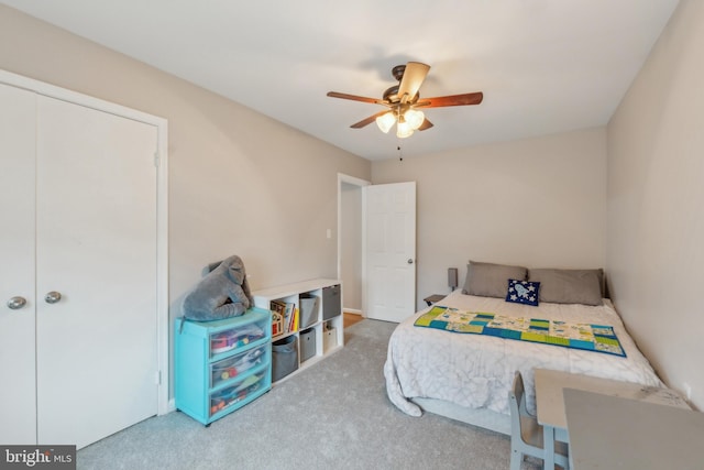 carpeted bedroom with a ceiling fan