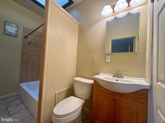 full bath with toilet, tile patterned flooring, baseboards, and vanity