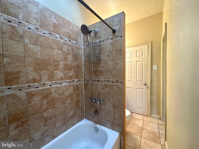 bathroom with tile patterned flooring, bathtub / shower combination, and toilet