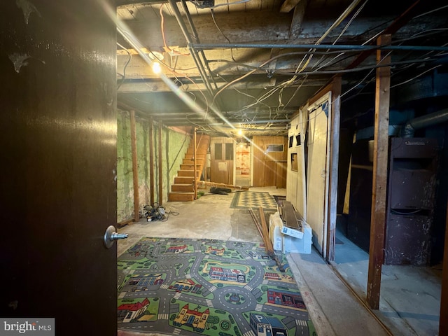 unfinished basement with stairway