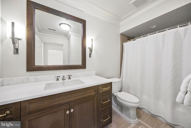 full bathroom featuring ornamental molding, visible vents, vanity, and toilet