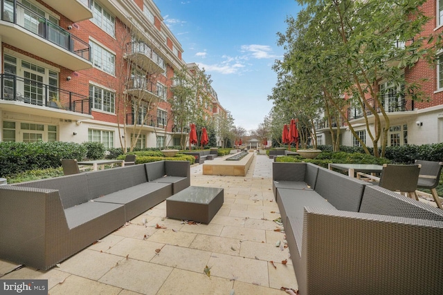 view of home's community featuring outdoor lounge area and a patio