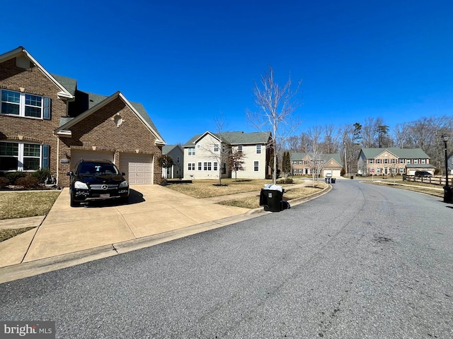 view of road with a residential view, curbs, and sidewalks