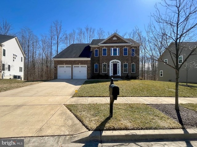 view of front facade with a garage, concrete driveway, cooling unit, a front lawn, and brick siding