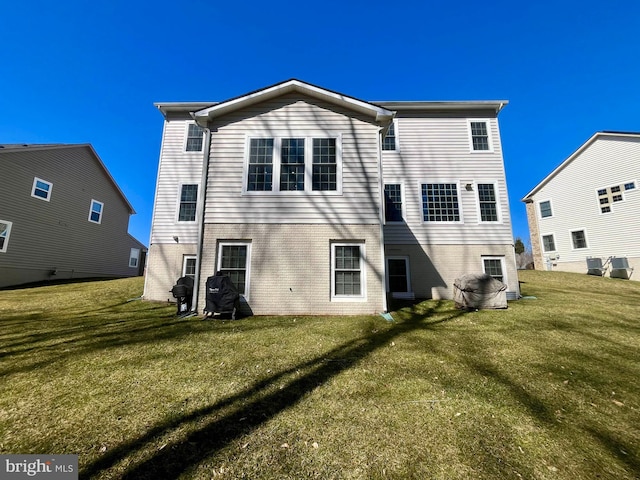 rear view of house with a lawn