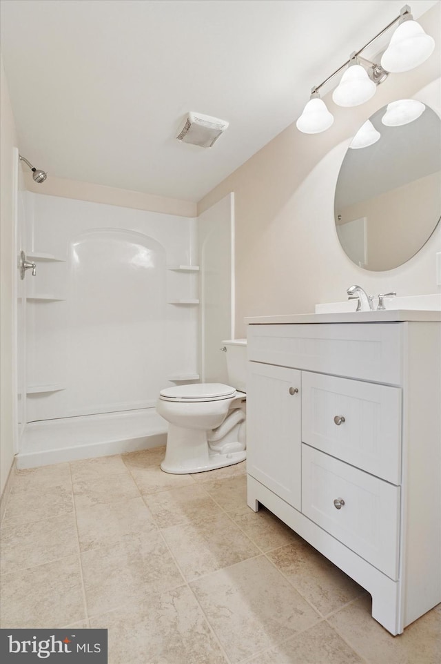 full bath featuring toilet, visible vents, walk in shower, and vanity