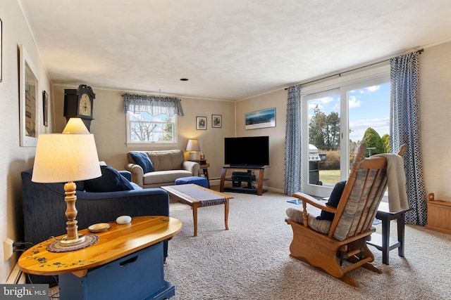 carpeted living room with baseboards