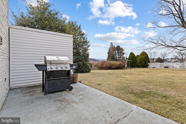 view of yard with fence and a patio