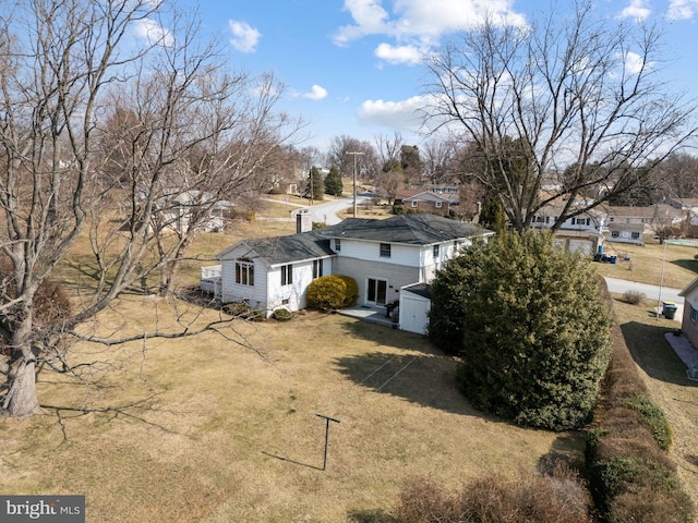 exterior space with a front lawn