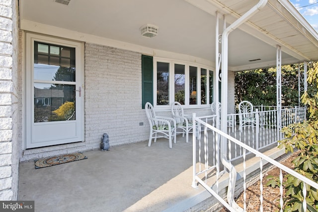 view of patio with visible vents and a porch