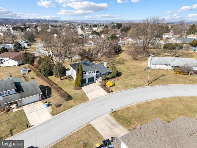 birds eye view of property with a residential view