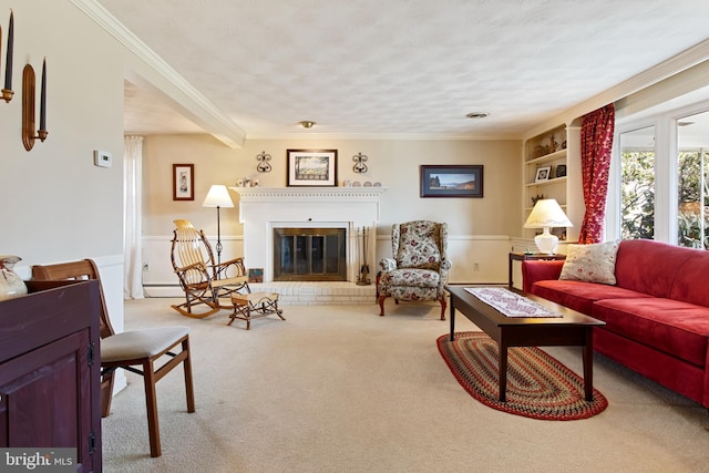 carpeted living area featuring a textured ceiling, a wainscoted wall, a fireplace, and crown molding